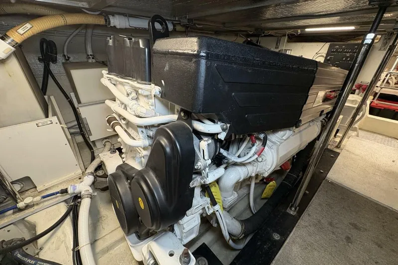 Carlet Vivian IV Yacht Photos Pics Engine room of a 2004 Carver 56 Voyager yacht, showcasing mechanical components.
