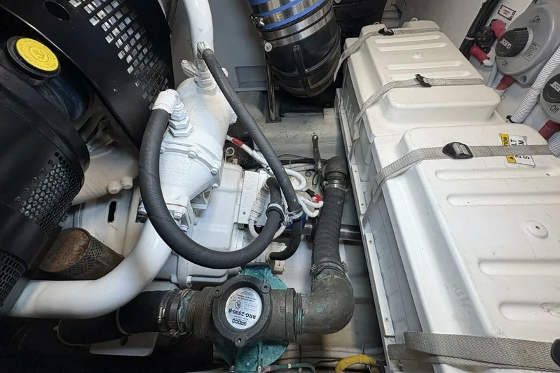 Carlet Vivian IV Yacht Photos Pics Engine room of a 2004 Carver 56 Voyager yacht, showcasing mechanical components and systems.