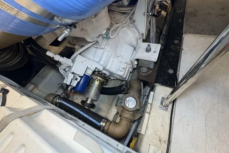 Carlet Vivian IV Yacht Photos Pics Engine compartment of a 2004 Carver 56 Voyager yacht, showcasing mechanical components.