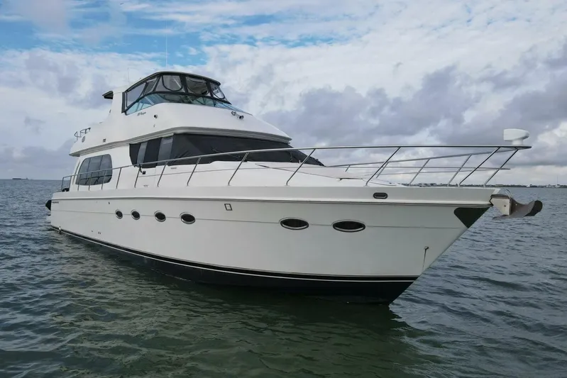 Carlet Vivian IV Yacht Photos Pics 2004 Carver 56 Voyager yacht on open water under cloudy sky.