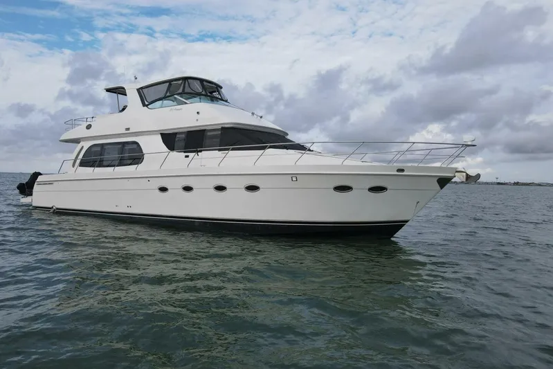 Carlet Vivian IV Yacht Photos Pics 2004 Carver 56 Voyager yacht on open water under cloudy sky.