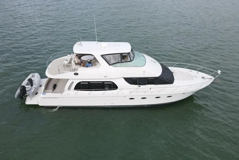 Carlet Vivian IV Yacht Photos Pics 2004 Carver 56 Voyager yacht cruising on calm waters, aerial view.