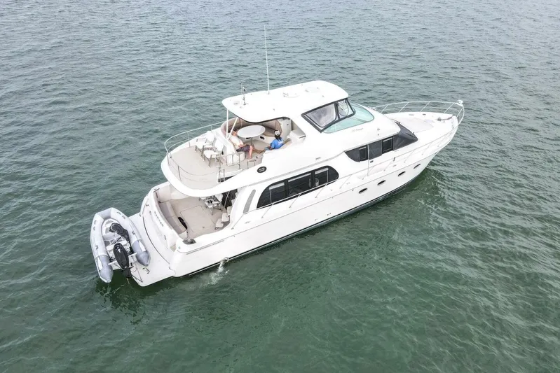 Carlet Vivian IV Yacht Photos Pics 2004 Carver 56 Voyager yacht cruising on open water, aerial view.