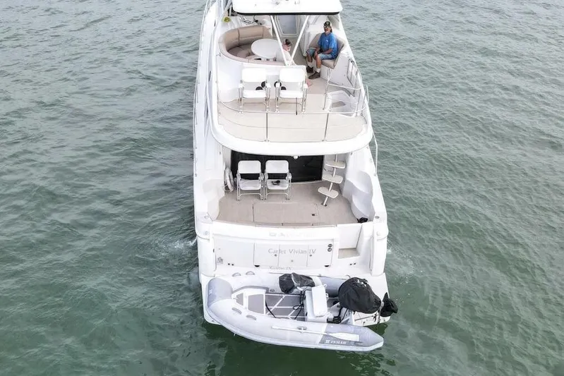 Carlet Vivian IV Yacht Photos Pics 2004 Carver 56 Voyager yacht on water, aerial view with two people onboard.