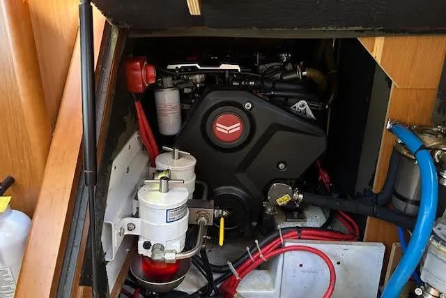  Yacht Photos Pics Engine compartment of a 2013 Beneteau Sense 46 sailboat, showcasing mechanical components.