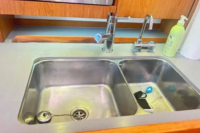  Yacht Photos Pics Stainless steel sink in 2013 Beneteau Sense 46 yacht kitchen with modern faucet.