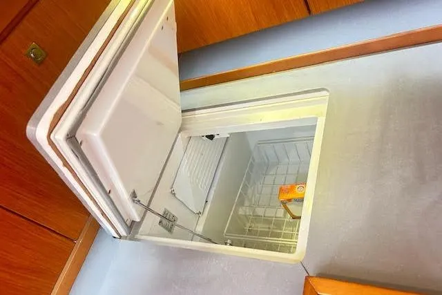  Yacht Photos Pics Open freezer compartment in 2013 Beneteau Sense 46 yacht interior.