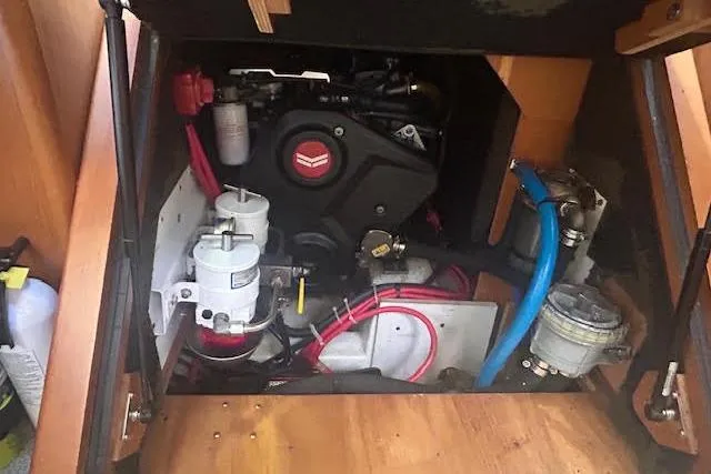  Yacht Photos Pics Engine compartment of a 2013 Beneteau Sense 46 sailboat, showcasing mechanical components.