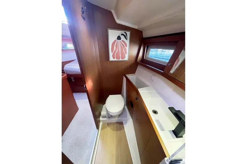  Yacht Photos Pics Interior of 2013 Beneteau Sense 46 yacht bathroom with modern fixtures and artwork.