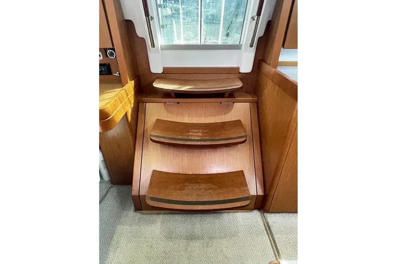  Yacht Photos Pics Interior wooden steps of 2013 Beneteau Sense 46 yacht, leading to deck.