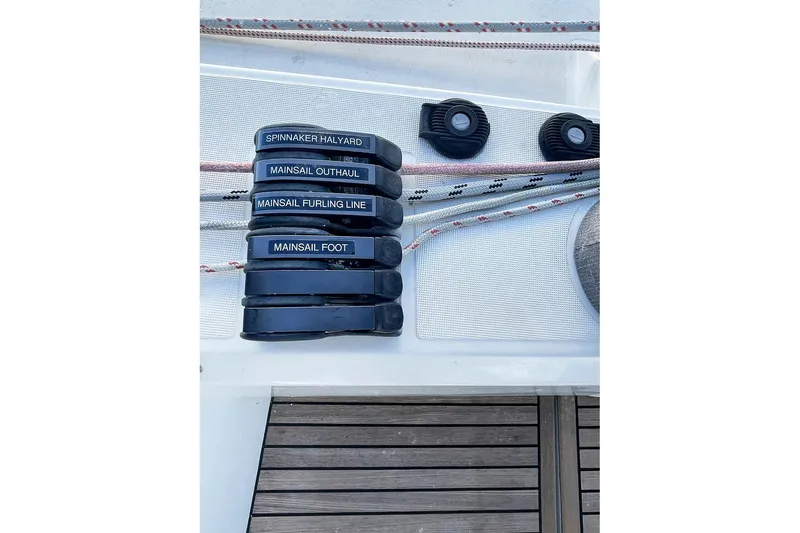  Yacht Photos Pics Deck controls on a 2013 Beneteau Sense 46 sailboat, featuring labeled lines and cleats.