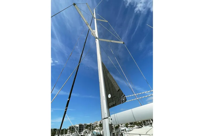  Yacht Photos Pics Mast and rigging of 2013 Beneteau Sense 46 sailboat against clear blue sky.