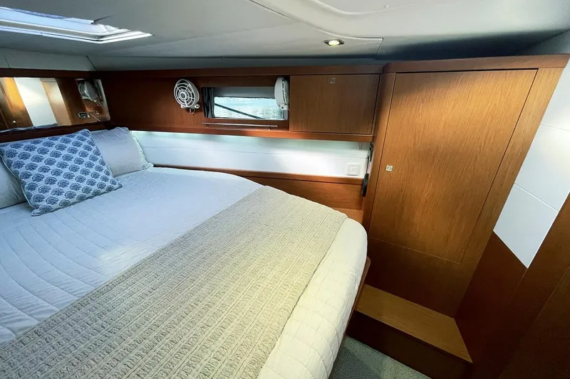  Yacht Photos Pics Luxurious cabin interior of 2013 Beneteau Sense 46 yacht with wooden finishes.