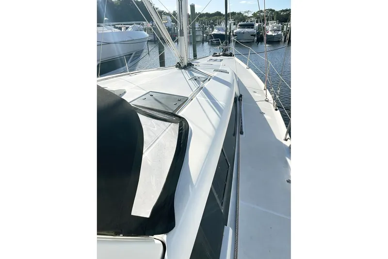  Yacht Photos Pics 2013 Beneteau Sense 46 sailboat deck view at marina.