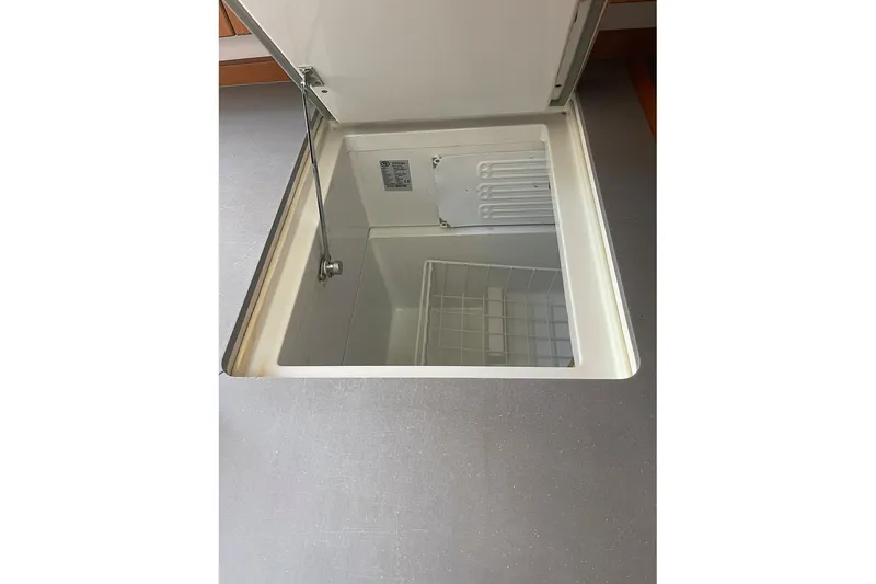  Yacht Photos Pics Open storage compartment on 2013 Beneteau Sense 46 yacht, featuring a built-in cooler.