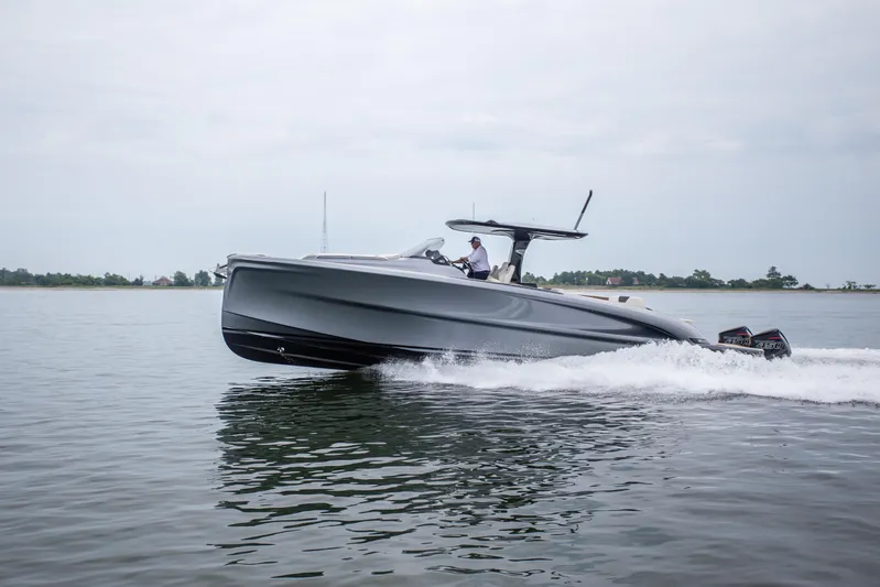  Yacht Photos Pics 2024 Solaris Power 40F Open yacht cruising on calm waters.