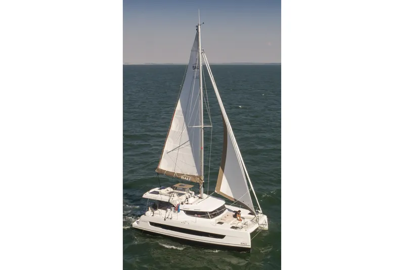  Yacht Photos Pics 2026 Bali CATSPACE catamaran sailing on open sea with full sails.