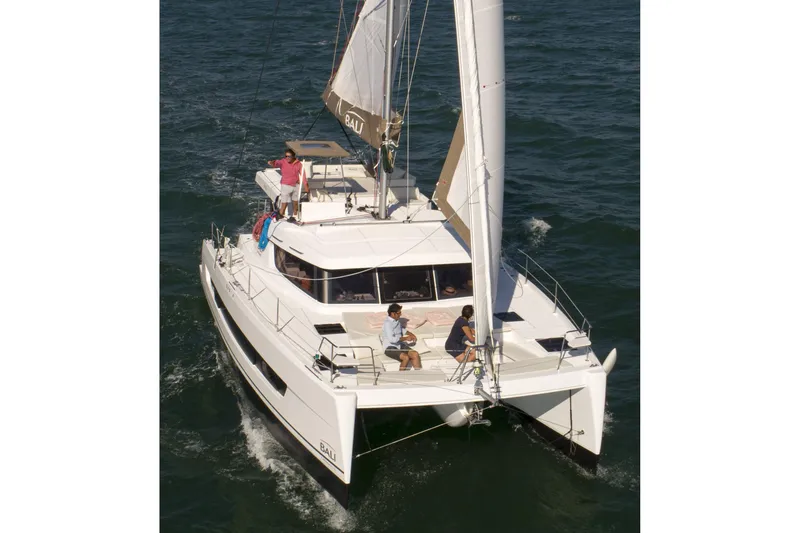  Yacht Photos Pics 2026 Bali CATSPACE catamaran sailing on open water with passengers enjoying the deck.