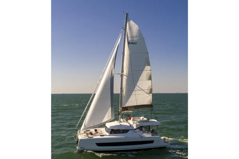  Yacht Photos Pics 2026 Bali CATSPACE catamaran sailing on open sea under clear blue sky.