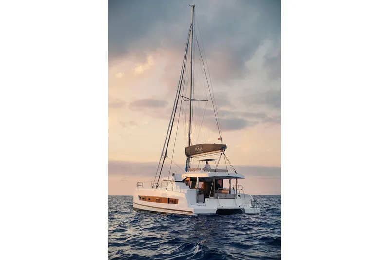 Yacht Photos Pics 2026 Bali CATSPACE catamaran sailing at sunset on open sea.
