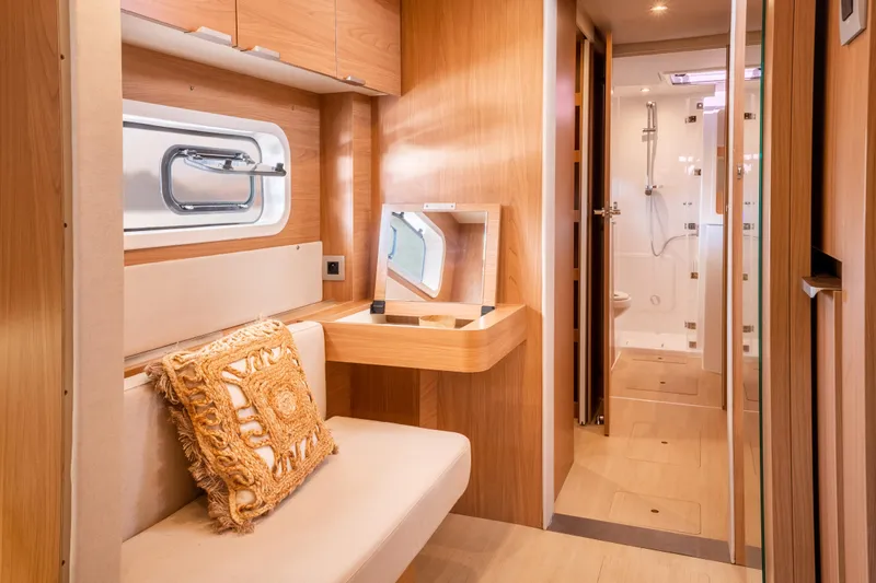  Yacht Photos Pics Luxurious interior of 2026 Bali CATSPACE yacht with elegant wood finish and modern amenities.