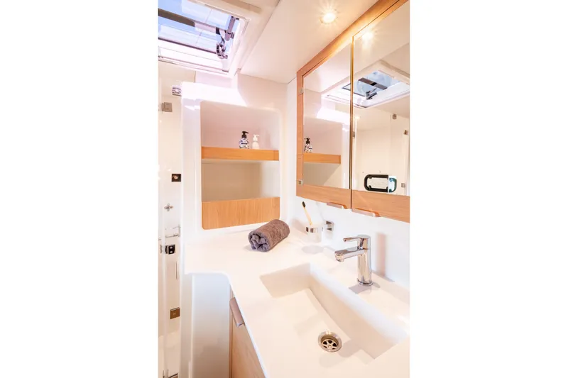  Yacht Photos Pics Modern bathroom interior of 2026 Bali CATSPACE yacht with sleek fixtures and ample lighting.