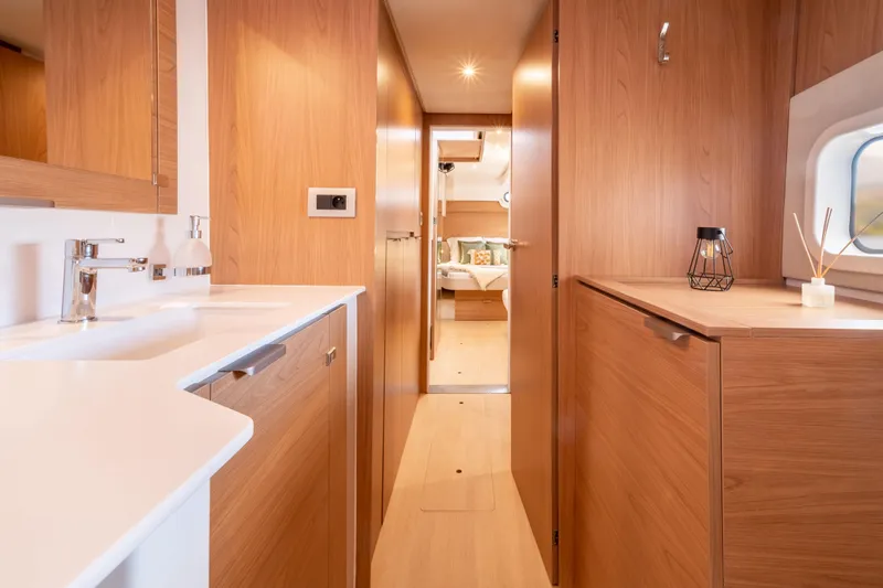 Yacht Photos Pics Luxurious interior of 2026 Bali CATSPACE yacht with modern wood finishes and elegant design.