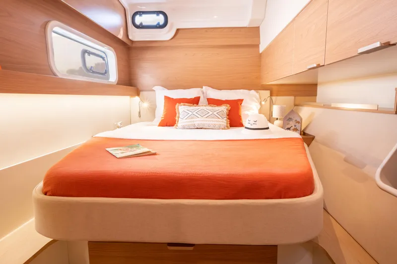 Yacht Photos Pics Luxurious 2026 Bali CATSPACE yacht cabin with cozy bed and modern decor.