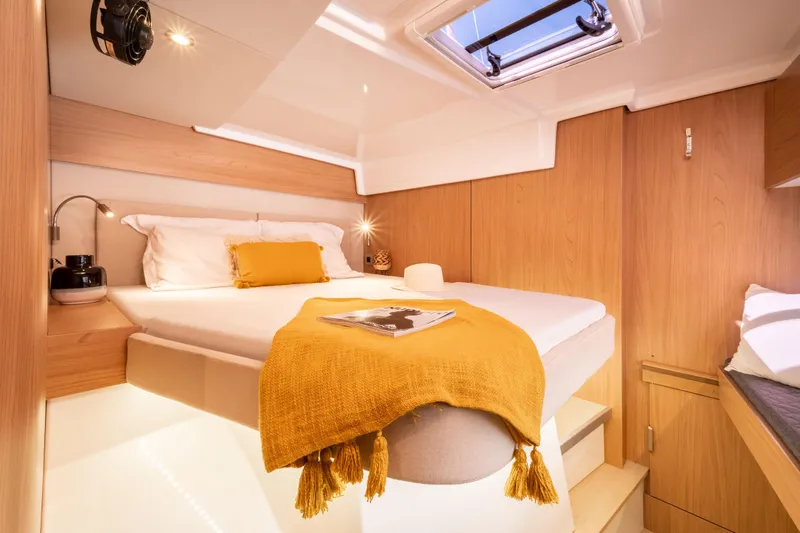  Yacht Photos Pics Luxurious 2026 Bali CATSPACE yacht cabin with cozy bed and modern decor.