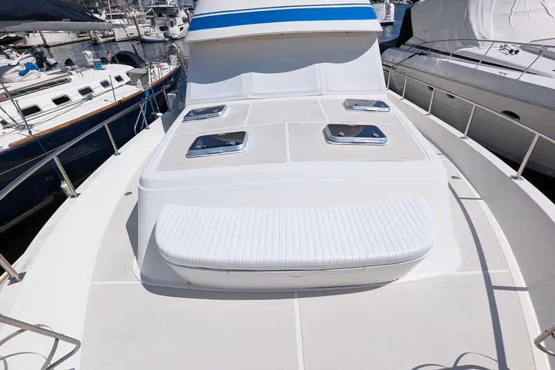 Fishers Folly IV Yacht Photos Pics 1988 Offshore Yachts 48 Yachtfisher, spacious deck view at marina.