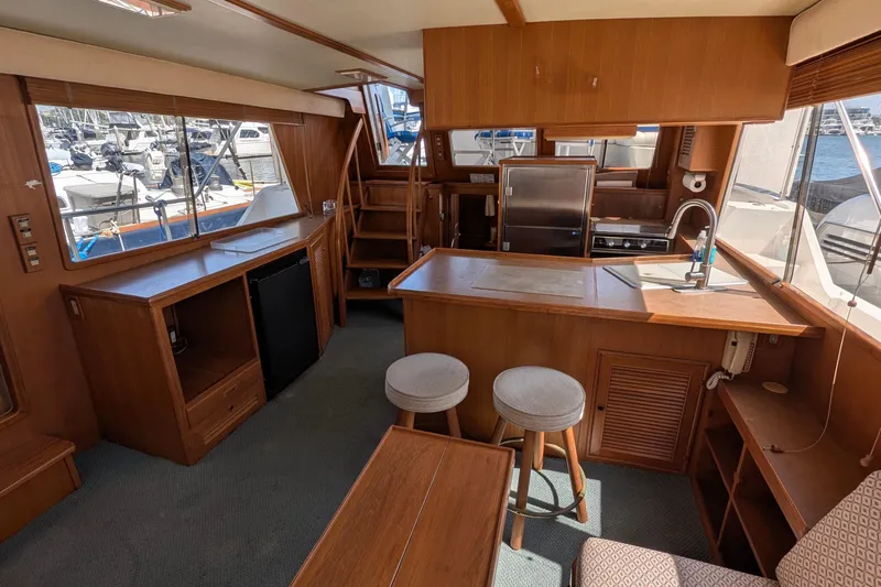 Fishers Folly IV Yacht Photos Pics Interior of 1988 Offshore Yachts 48 Yachtfisher with wood finish and modern amenities.
