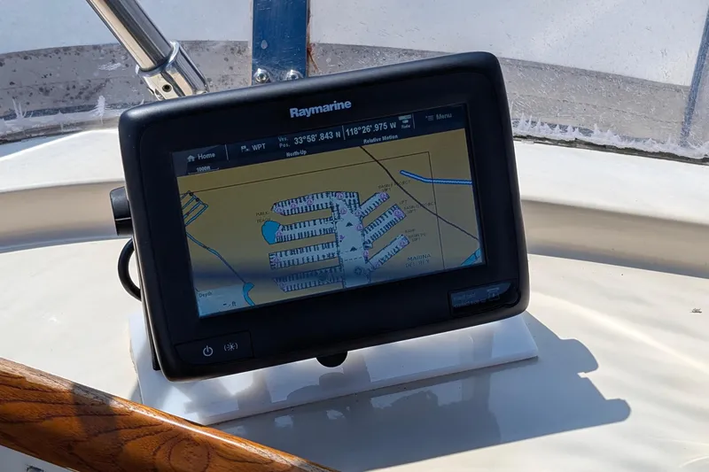 Fishers Folly IV Yacht Photos Pics Raymarine navigation system on 1988 Offshore Yachts 48 Yachtfisher, displaying marina map.