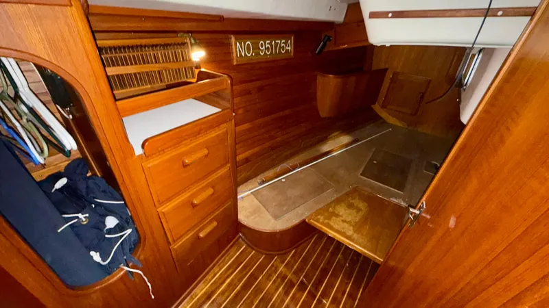 Elan Yacht Photos Pics 1989 J Boats J/40 interior cabin with wooden finish and storage compartments.