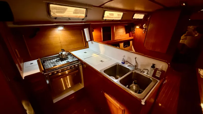 Elan Yacht Photos Pics Interior of 1989 J Boats J/40 yacht kitchen with stove and dual sinks.