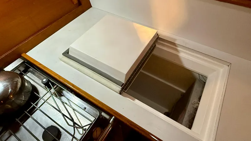 Elan Yacht Photos Pics Interior view of a 1989 J Boats J/40 sailboat galley with open storage compartment.