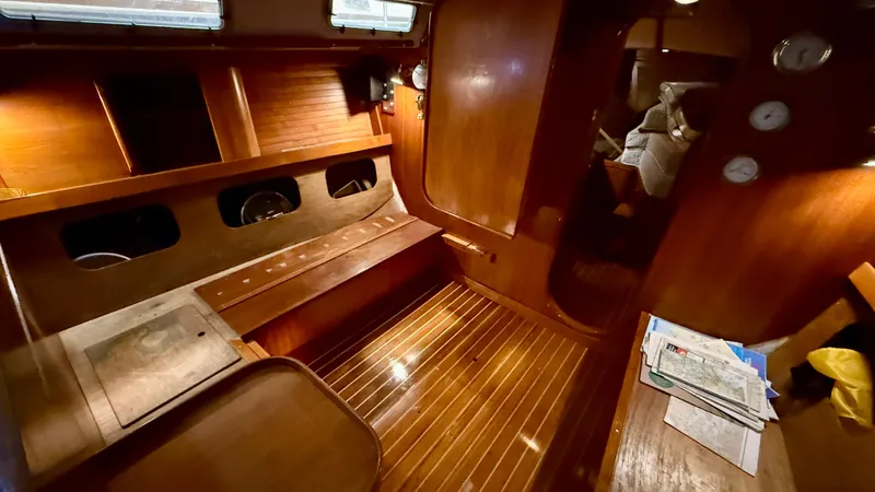 Elan Yacht Photos Pics Interior of 1989 J Boats J/40 sailboat with polished wood finish and cozy seating area.