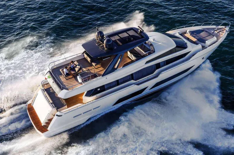 E3 Yacht Photos Pics Luxurious 2019 Ferretti Yachts 850 cruising on open water, showcasing sleek design and elegance.