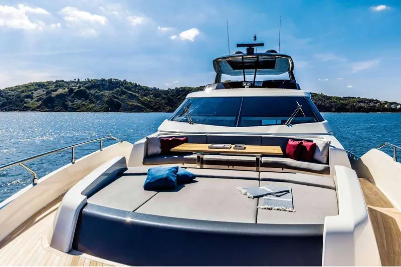 E3 Yacht Photos Pics Luxurious 2019 Ferretti Yachts 850 cruising on serene waters with scenic island backdrop.