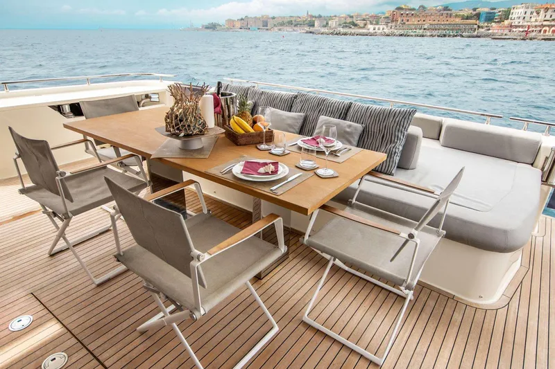 E3 Yacht Photos Pics Luxury dining area on 2019 Ferretti Yachts 850 with ocean view and elegant table setting.