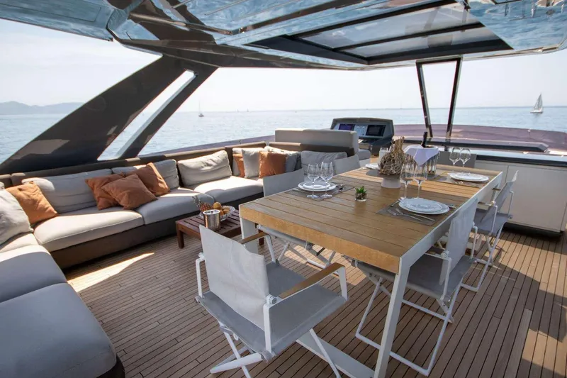 E3 Yacht Photos Pics Luxurious 2019 Ferretti Yachts 850 deck with elegant dining setup and ocean view.