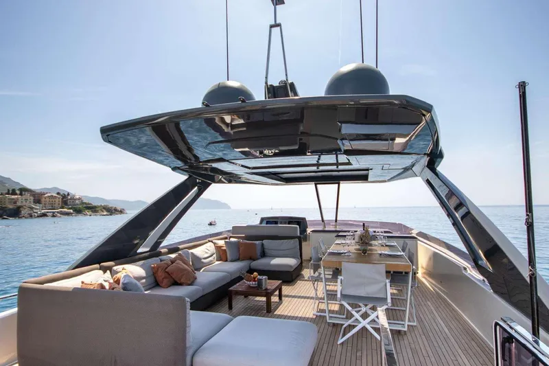E3 Yacht Photos Pics Luxurious 2019 Ferretti Yachts 850 with elegant outdoor seating and dining area on deck.