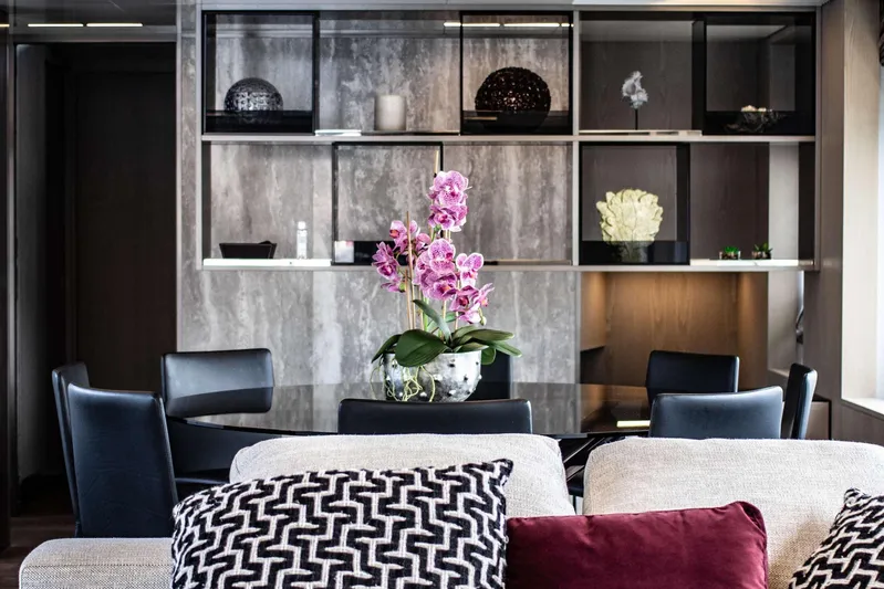 E3 Yacht Photos Pics Luxurious Ferretti Yachts 850 interior with elegant dining area and decorative orchids, 2019 model.