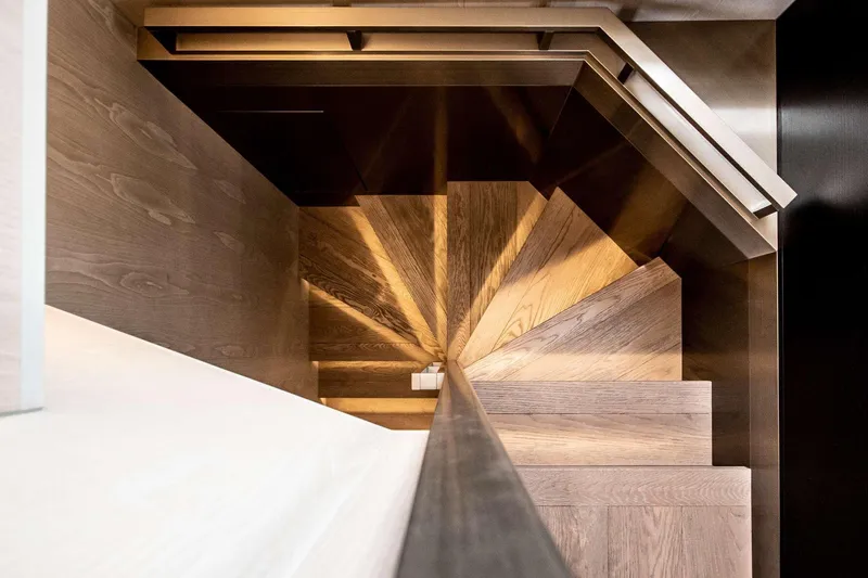 E3 Yacht Photos Pics Spiral staircase with wooden steps inside 2019 Ferretti Yachts 850.