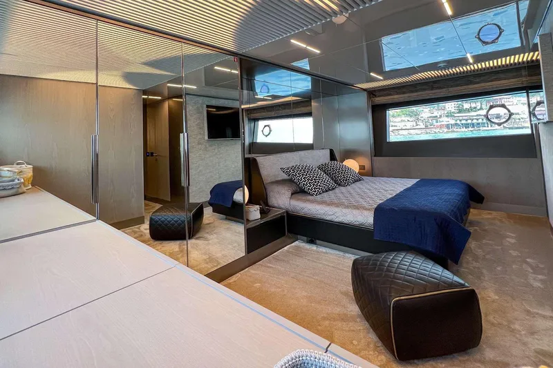 E3 Yacht Photos Pics Luxurious bedroom interior of 2019 Ferretti Yachts 850, featuring modern design and large window views.