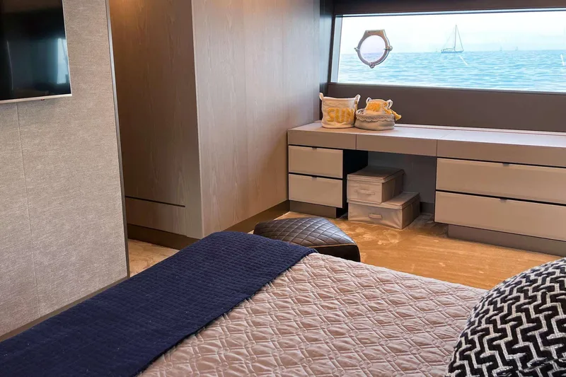 E3 Yacht Photos Pics Luxurious bedroom interior of 2019 Ferretti Yachts 850 with ocean view and modern decor.