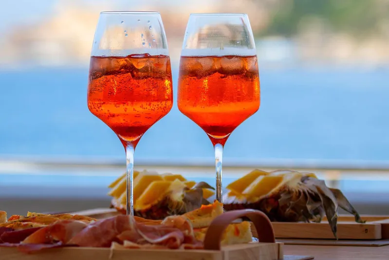 E3 Yacht Photos Pics Two Aperol Spritz glasses with appetizers on a Ferretti Yachts 850, 2019 model.