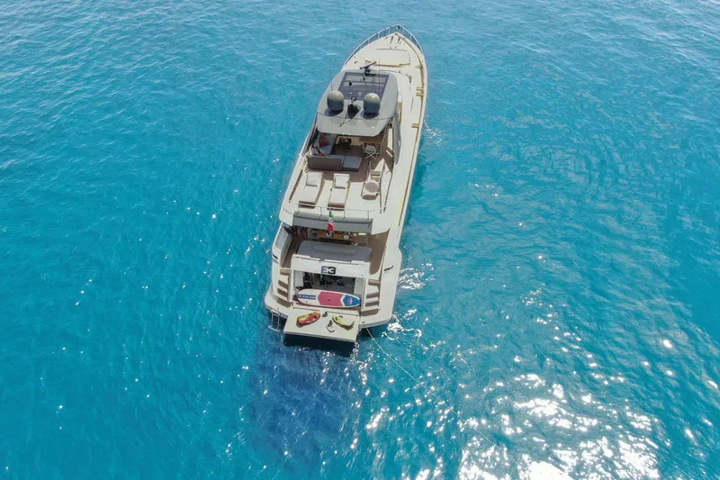 E3 Yacht Photos Pics Aerial view of 2019 Ferretti Yachts 850 on clear blue water.