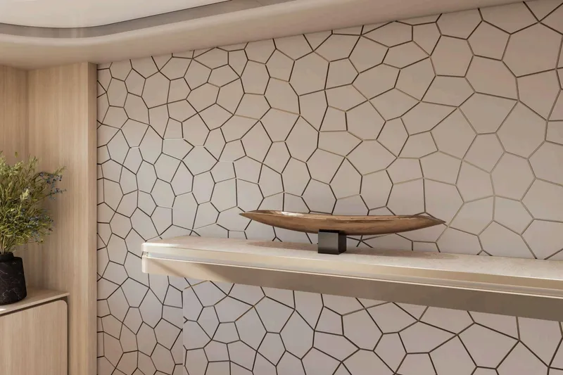  Yacht Photos Pics Modern interior with geometric wall tiles, wooden shelf, and decorative plant. Nomad 101, 2026 design.