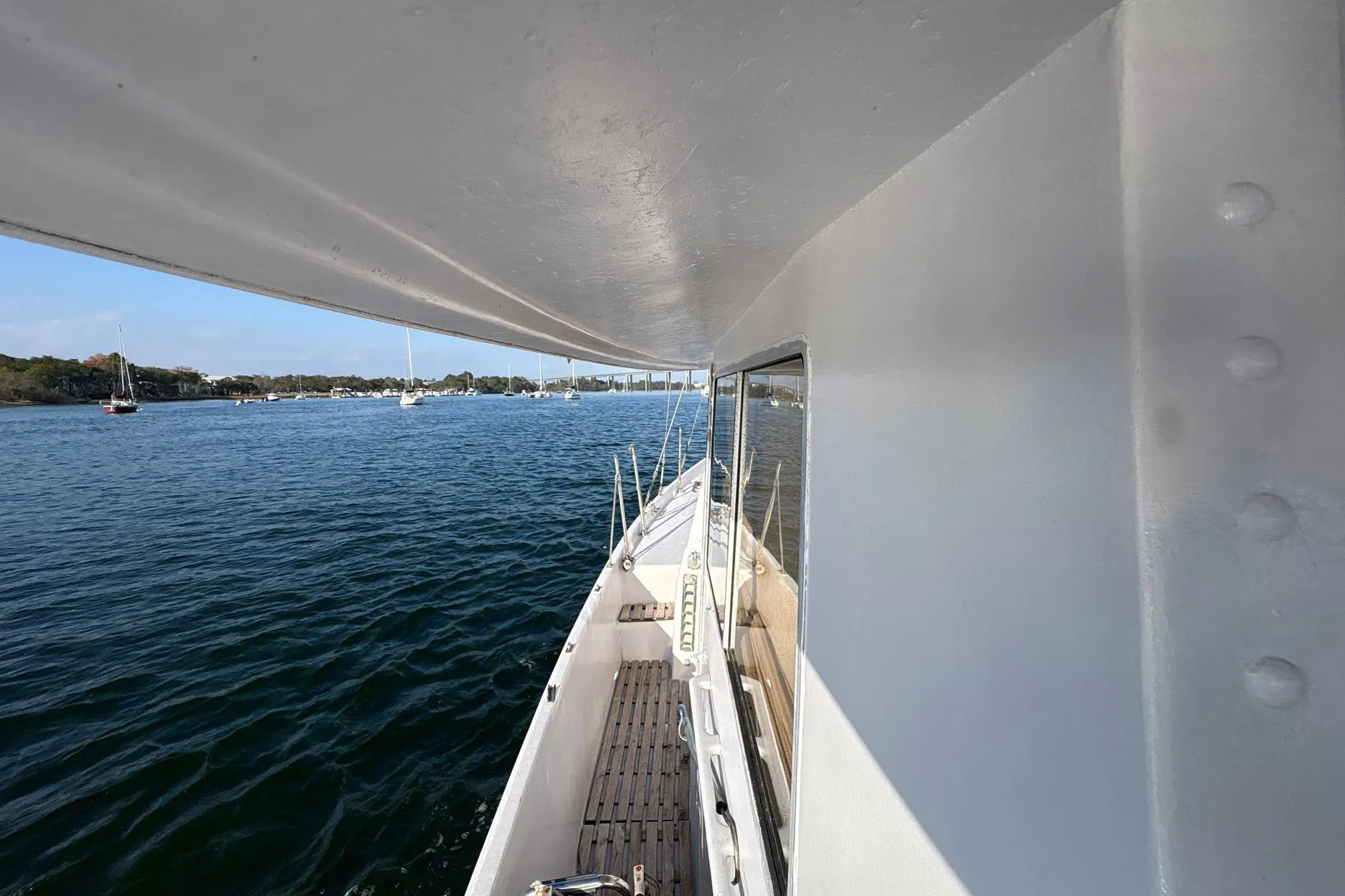 1979 Schucker 436 Motorsailor on calm waters, showcasing deck and cabin view.