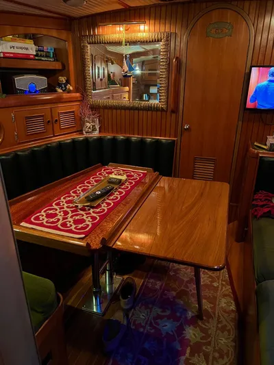 Aries Yacht Photos Pics Cozy 1982 Sea Star 46 yacht interior with wooden dining area and decorative mirror.